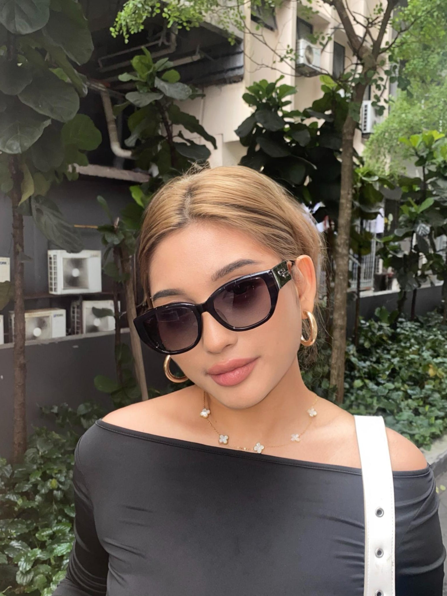 Women with hijab in stylish asian fitting sunglasses. A pair of square-shaped, Cat-eye sunglasses with a full plastic frame.Womens Asian fitting Sunglasses. Stacy in Marble Grey - Gradient Lens
