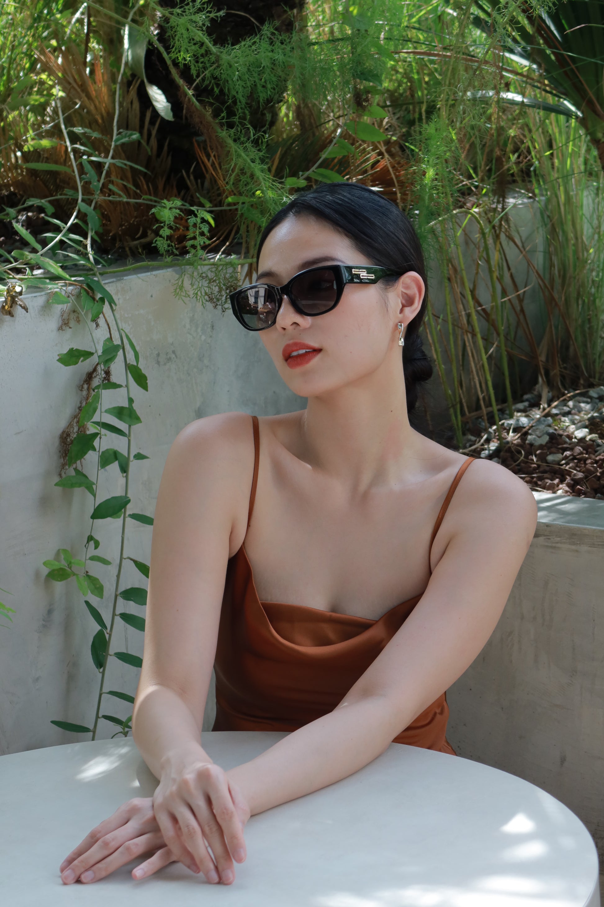 Women with hijab in stylish asian fitting sunglasses. A pair of square-shaped, Cat-eye sunglasses with a full plastic frame.Womens Asian fitting Sunglasses. Stacy in Black - Gradient Lens