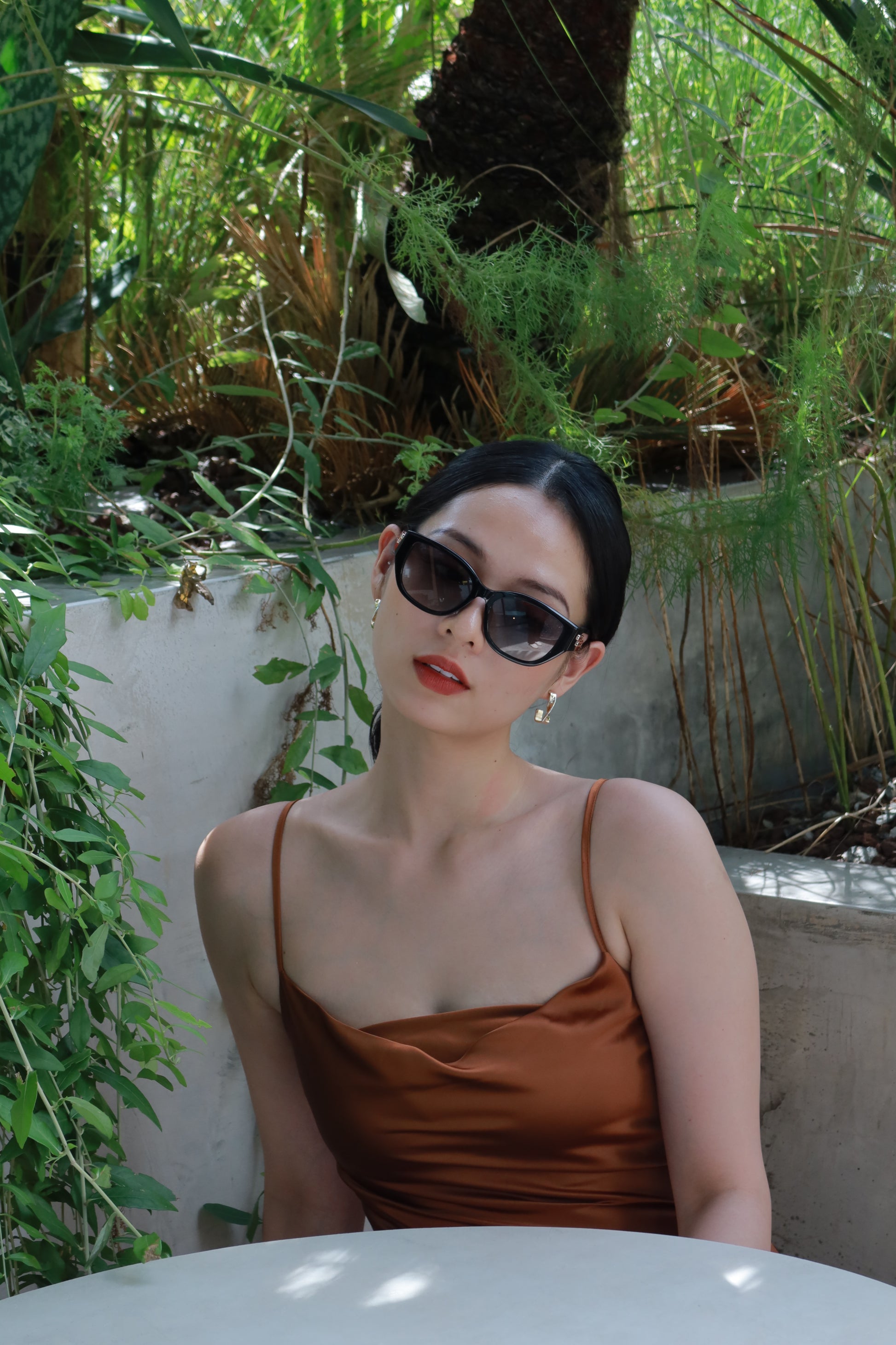 Women with hijab in stylish asian fitting sunglasses. A pair of square-shaped, Cat-eye sunglasses with a full plastic frame.Womens Asian fitting Sunglasses. Stacy in Black - Gradient Lens