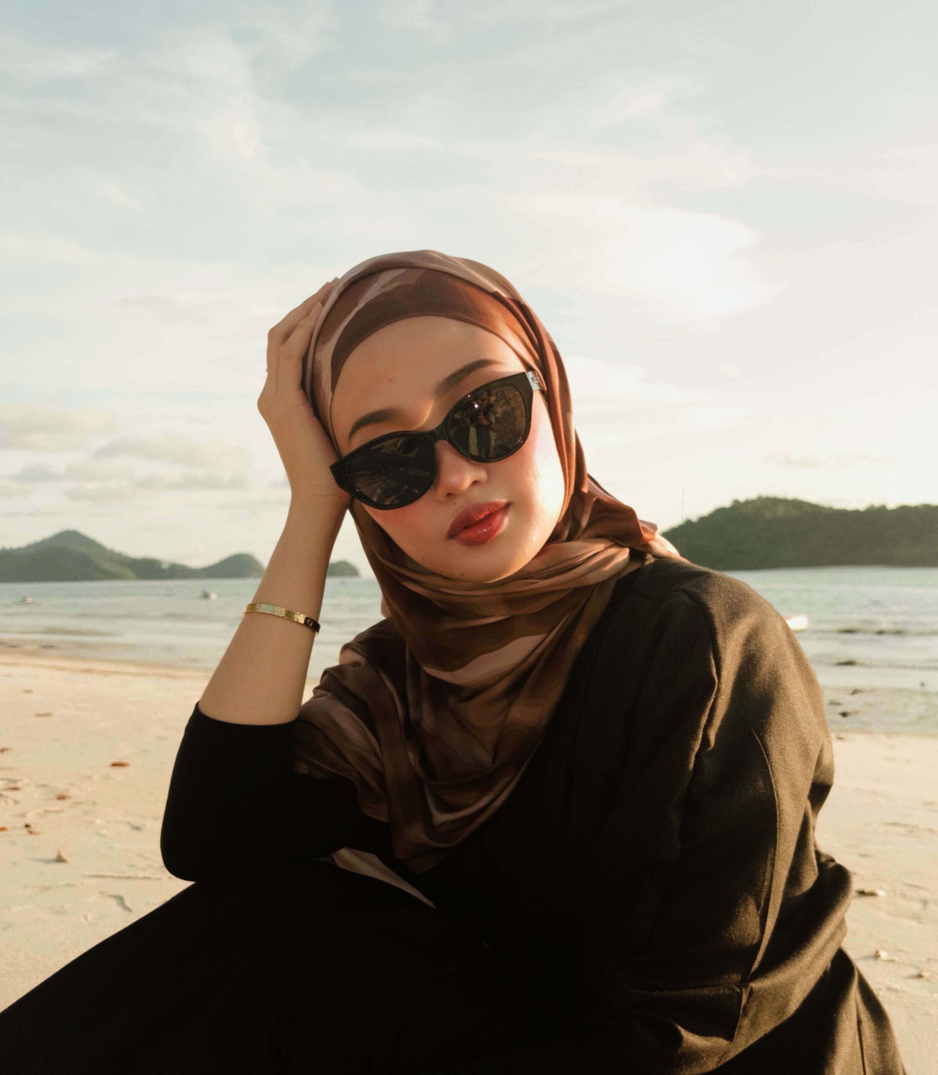 Woman wearing a hijab and sunglasses Maya in Black - Black Lens with black lenses