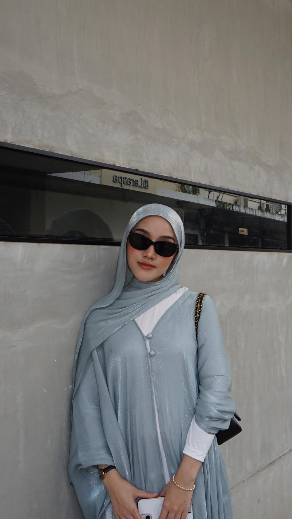 Women with hijab in stylish asian fitting sunglasses. A pair of square-shaped, green-tinted sunglasses with a full plastic frame.Womens Asian fitting Sunglasses. Ruby in Black - Black Lens 