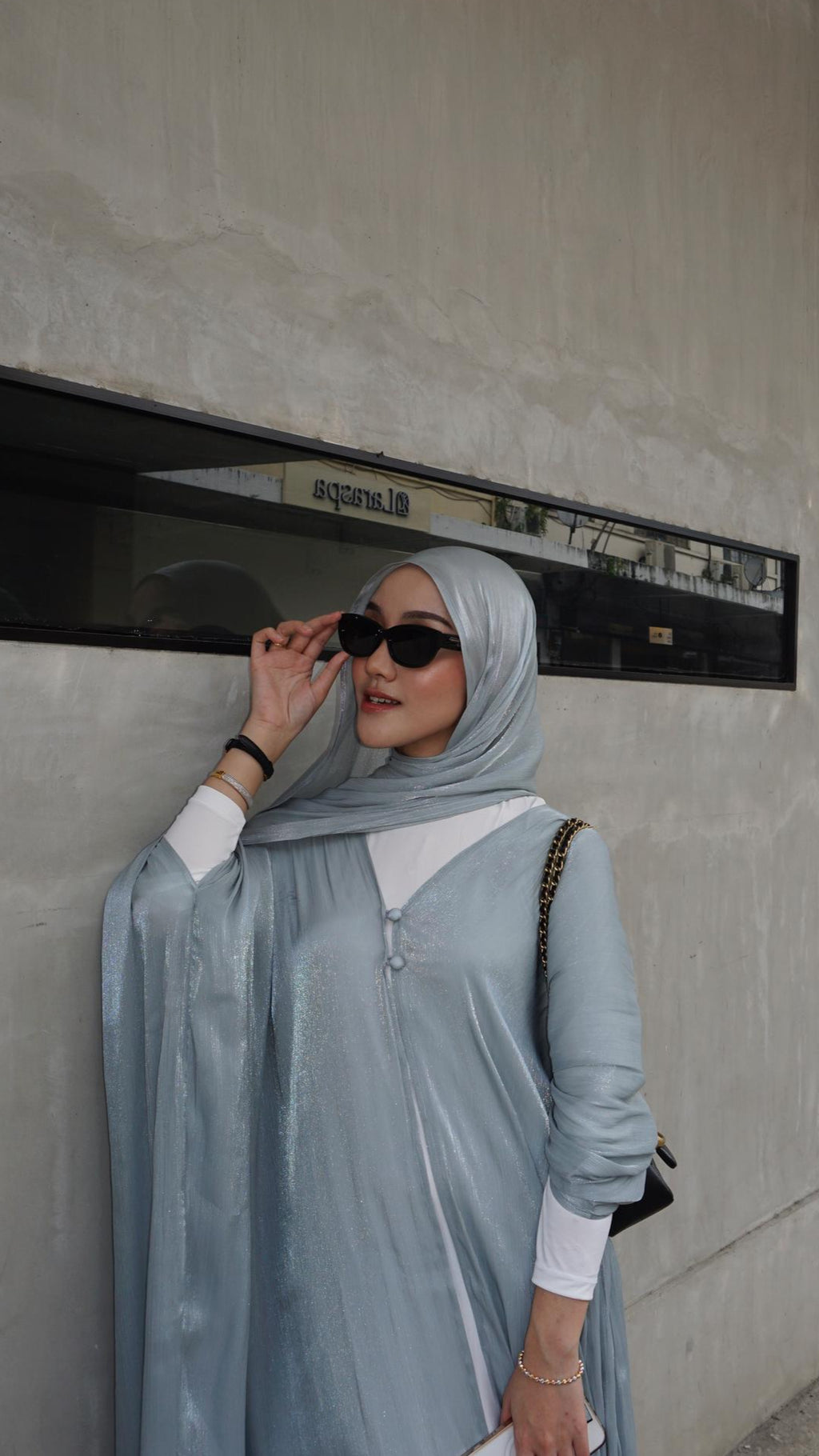 Women with hijab in stylish asian fitting sunglasses. A pair of square-shaped, green-tinted sunglasses with a full plastic frame.Womens Asian fitting Sunglasses. Ruby in Black - Black Lens 