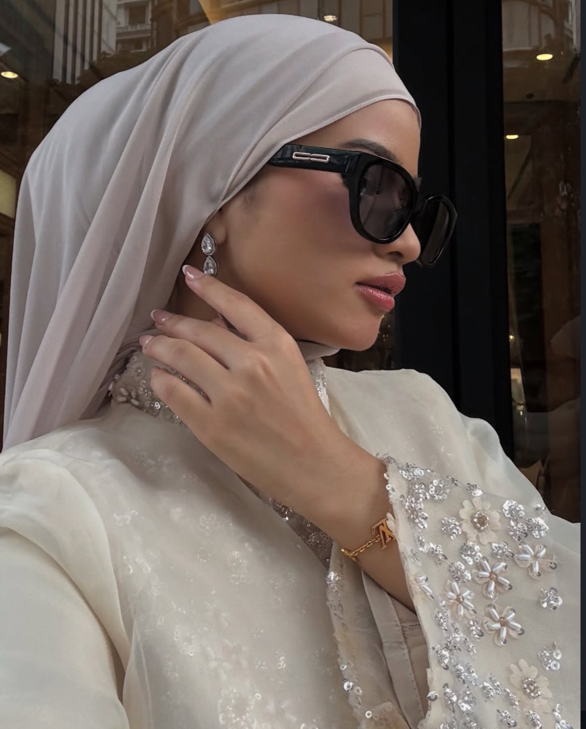 Model with hijab in womens sunglasses . Maya in Black - Gradient Lenses 
