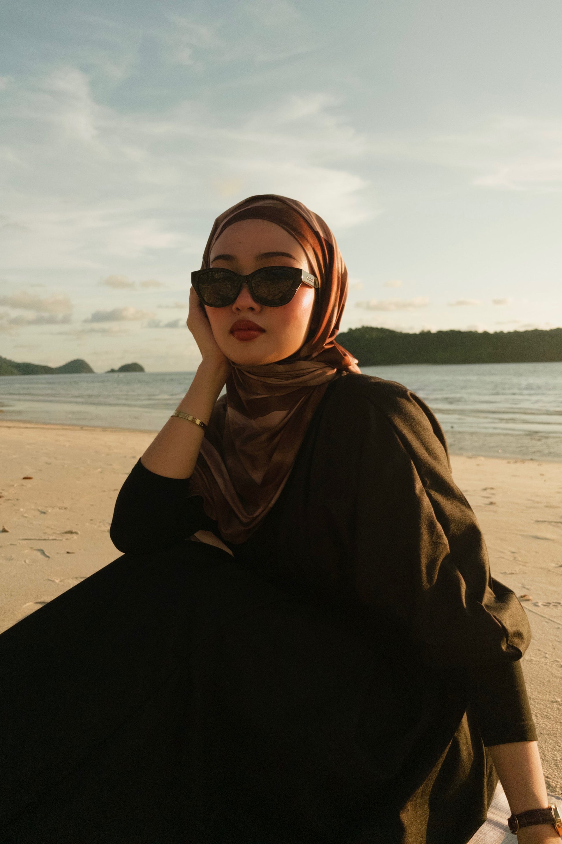 Woman wearing a hijab and sunglasses Maya in Black - Black Lens  with black lenses 