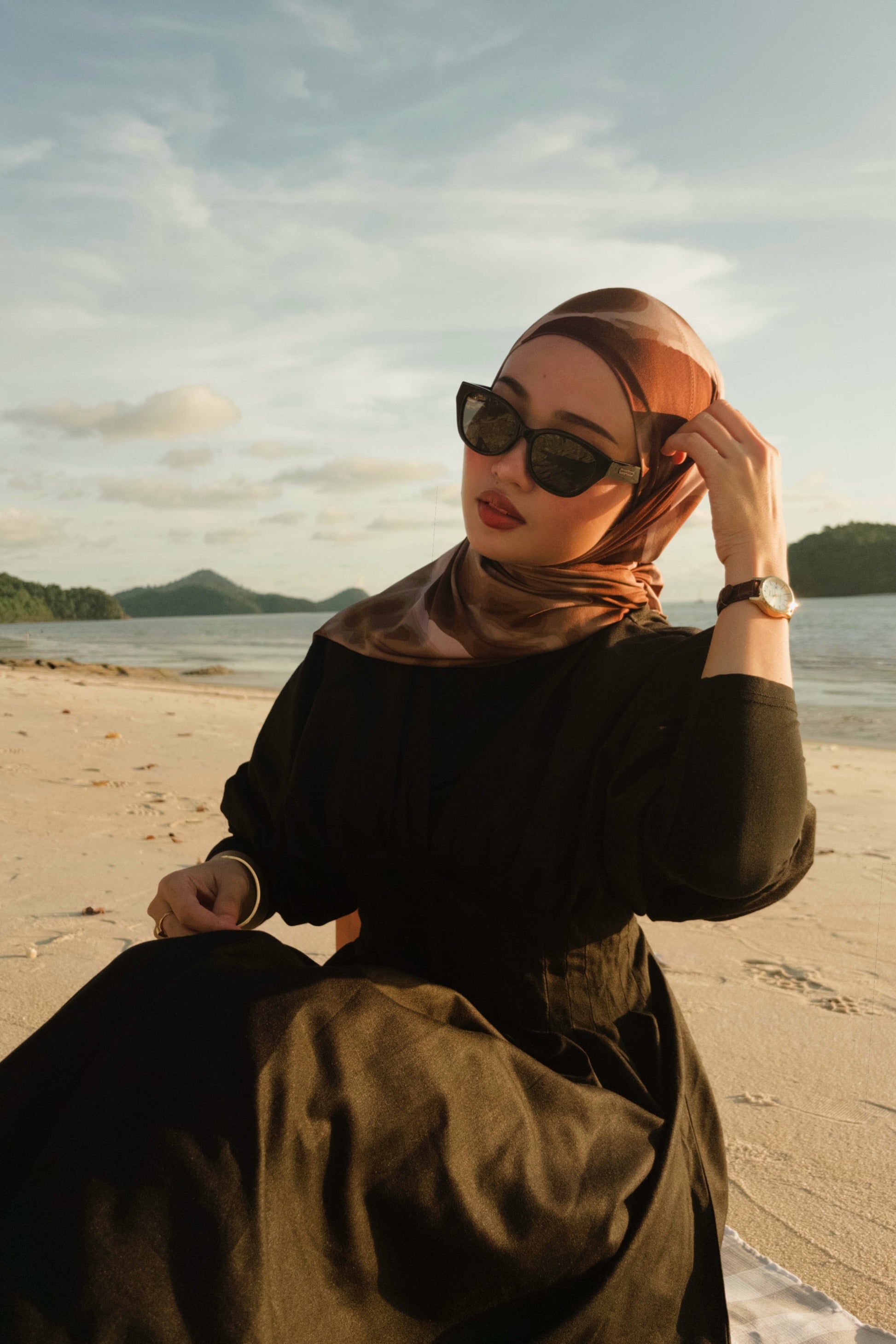 Woman wearing a hijab and sunglasses Maya in Black - Black Lens with black lenses