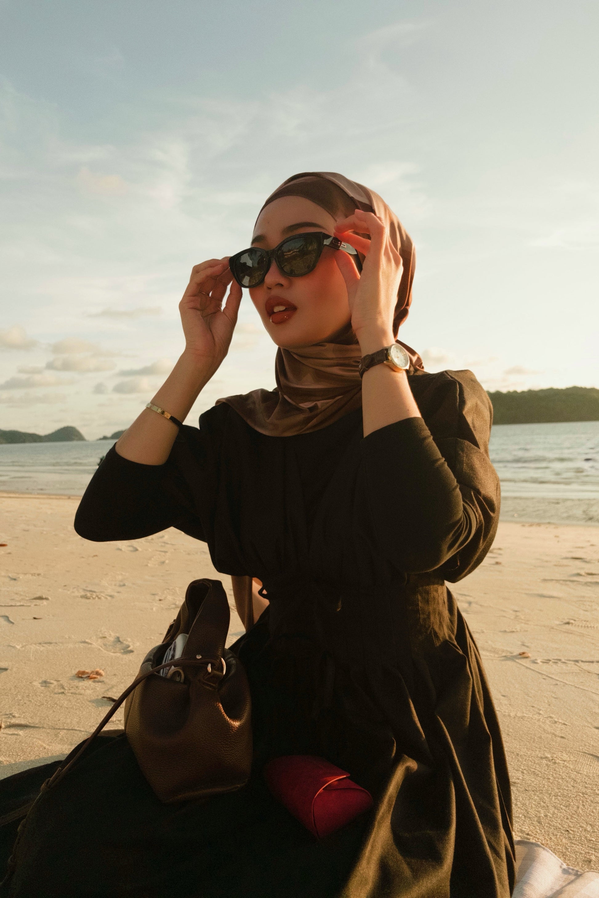 Woman wearing a hijab and sunglasses Maya in Black - Black Lens with black lenses