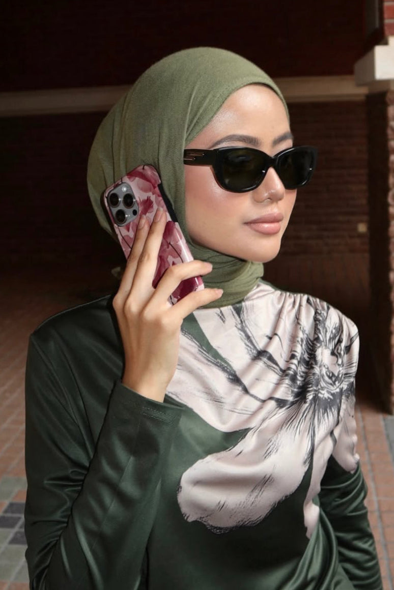 Women with hijab in stylish asian fitting sunglasses. A pair of square-shaped, green-tinted sunglasses with a full plastic frame.Womens Asian fitting Sunglasses. Ruby in Olive - Green Lens 